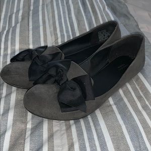 Gray suede flats with black bow